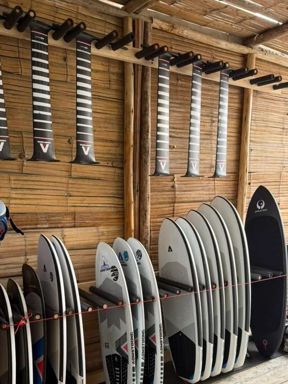 Close view of rental foil boards and Armstrong masts stored in Chicama.